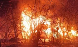 Yanan evinin 10 metre ilerisinde ağaçta asılı cesedi bulundu