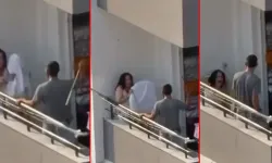 Tartıştığı kadını balkonda sopayla dövdü!
