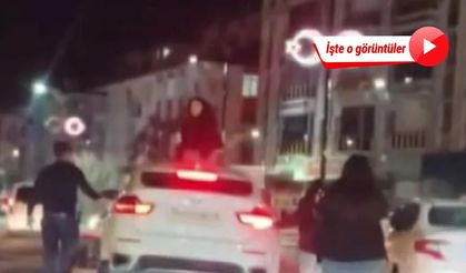 Kadın sürücü, trafikte tartıştığı kişinin otomobilinin üzerine çıktı!