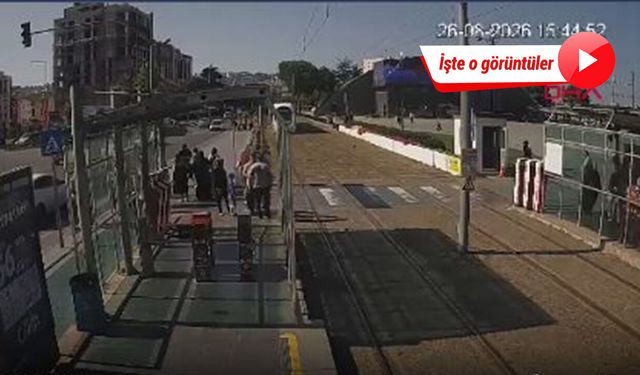 Raylara atlayan küçük kızı tişörtünden çekerek kurtardı