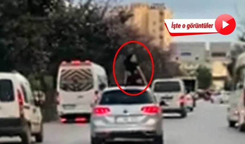 Trafikte seyir halindeki aracın üzerinde dans etti!