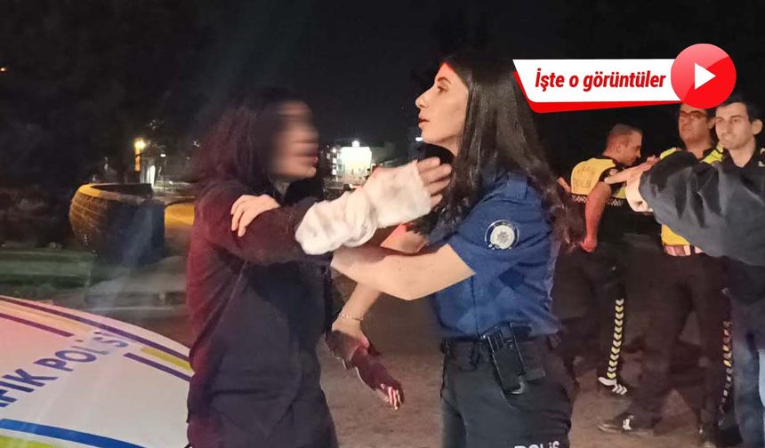 Otomobiliyle ters yöne giren kadın, polise direnip gazetecilere tükürdü